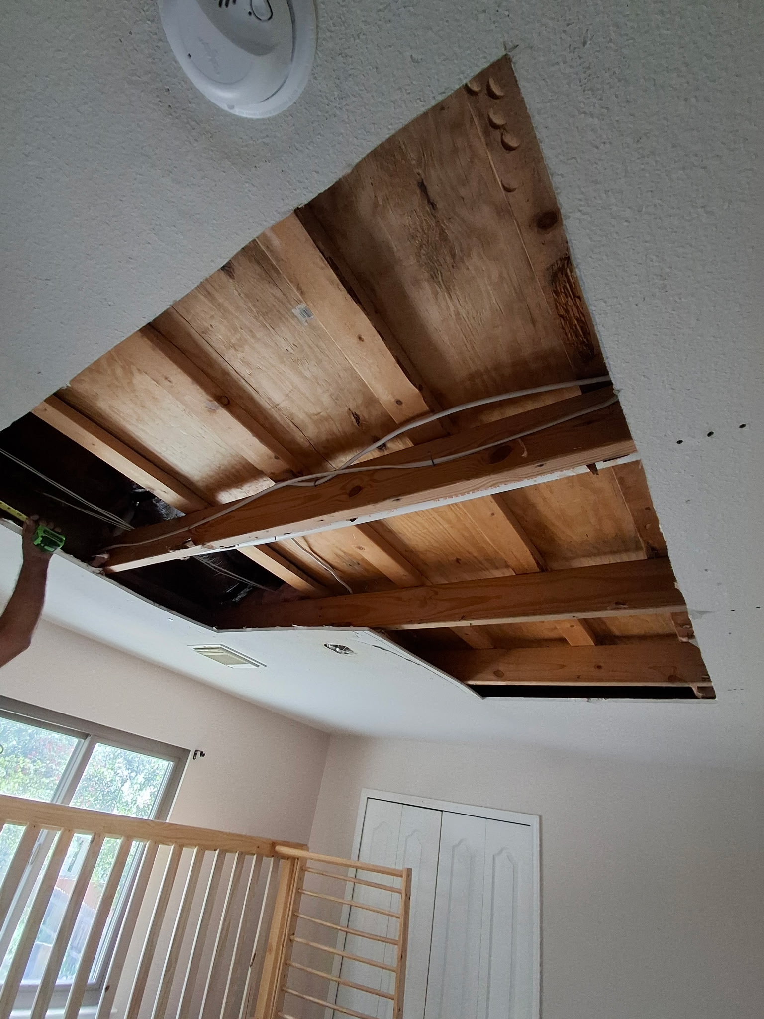 Ceiling opening prepared for drywall repair